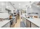 Modern kitchen featuring gray cabinets, stainless steel appliances, and ample counter space at 2653 Partridge Trl, Duluth, GA 30097