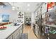 Well-lit kitchen showcasing stainless steel appliances, light-colored cabinets, and open views to the dining room at 2653 Partridge Trl, Duluth, GA 30097