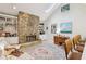 Cozy living room with a stunning stone fireplace, built-in shelves and natural light at 2653 Partridge Trl, Duluth, GA 30097