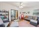 Inviting sunroom with tile flooring, ceiling fan, and sliding glass door leading to outdoor space at 2653 Partridge Trl, Duluth, GA 30097