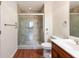 Bathroom featuring a tiled shower with a glass door, toilet, and single sink vanity at 300 Johnson Ferry Ne Rd # B808, Atlanta, GA 30328