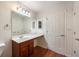 Bathroom featuring a single sink vanity and wainscoting, and a large mirror at 300 Johnson Ferry Ne Rd # B808, Atlanta, GA 30328