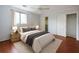 Comfortable bedroom featuring a plush bed, hardwood floors, closet and a ceiling fan at 300 Johnson Ferry Ne Rd # B808, Atlanta, GA 30328