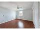 Simple bedroom with hardwood floors, closet, and a window offering natural light at 300 Johnson Ferry Ne Rd # B808, Atlanta, GA 30328