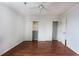 Well-lit bedroom featuring hardwood floors, white trim, closet and a ceiling fan at 300 Johnson Ferry Ne Rd # B808, Atlanta, GA 30328