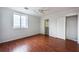 Bright bedroom with hardwood floors, closet, and ample natural light from the large window at 300 Johnson Ferry Ne Rd # B808, Atlanta, GA 30328