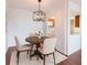 Dining room features modern lighting and neutral decor with a view to the kitchen at 300 Johnson Ferry Ne Rd # B808, Atlanta, GA 30328