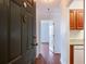 Inviting entryway with hardwood floors leading into the unit, enhanced by natural light and a peek of the kitchen at 300 Johnson Ferry Ne Rd # B808, Atlanta, GA 30328
