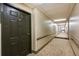 Well-maintained hallway with carpeting leading to apartment entrance, showcasing clean and inviting spaces at 300 Johnson Ferry Ne Rd # B808, Atlanta, GA 30328
