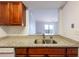 Kitchen with stainless steel sink and granite countertops that views living area at 300 Johnson Ferry Ne Rd # B808, Atlanta, GA 30328