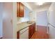 Cozy kitchen featuring granite countertops, wood cabinets, and appliances at 300 Johnson Ferry Ne Rd # B808, Atlanta, GA 30328
