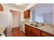Updated kitchen with wood cabinets, granite countertops, and white appliances at 300 Johnson Ferry Ne Rd # B808, Atlanta, GA 30328