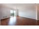 Bright, spacious living room with hardwood floors and sliding doors to a balcony at 300 Johnson Ferry Ne Rd # B808, Atlanta, GA 30328