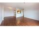 Spacious living room with hardwood floors, neutral paint, and views of the kitchen at 300 Johnson Ferry Ne Rd # B808, Atlanta, GA 30328