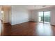 Living room featuring hardwood floors and sliding doors to a balcony at 300 Johnson Ferry Ne Rd # B808, Atlanta, GA 30328