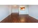 Open living room with hardwood floors, neutral paint, and views of the kitchen at 300 Johnson Ferry Ne Rd # B808, Atlanta, GA 30328