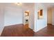 Living room has hardwood floors, neutral paint, and a pass through to the kitchen at 300 Johnson Ferry Ne Rd # B808, Atlanta, GA 30328