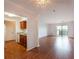 Open living space offering hardwood flooring and natural light leading to a sliding door to the balcony at 300 Johnson Ferry Ne Rd # B808, Atlanta, GA 30328