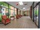 Comfortable seating area in a bright lobby with large windows offering views of the outside gardens at 300 Johnson Ferry Ne Rd # B808, Atlanta, GA 30328