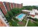 Aerial view of a refreshing community pool surrounded by lush landscaping, perfect for relaxing and entertaining at 300 Johnson Ferry Ne Rd # B808, Atlanta, GA 30328