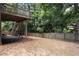 Large, grassy backyard featuring a fenced perimeter and wooden deck at 4062 Brookside Pkwy, Decatur, GA 30034