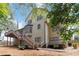 Exterior view of a multi-story home showcasing a large deck and backyard at 4062 Brookside Pkwy, Decatur, GA 30034