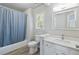 Classic bathroom with a shower-tub combo, framed mirror and a single sink vanity at 4062 Brookside Pkwy, Decatur, GA 30034
