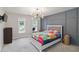 Stylish bedroom features a decorative accent wall and contemporary light fixture at 4062 Brookside Pkwy, Decatur, GA 30034