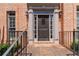 Close up of the front door with brick entrance, craftsman style door and sidelights at 4062 Brookside Pkwy, Decatur, GA 30034