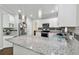 Bright kitchen featuring white cabinets and stainless steel appliances at 4062 Brookside Pkwy, Decatur, GA 30034