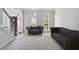 Bright and airy living room with neutral walls, carpet, and furnishings at 4062 Brookside Pkwy, Decatur, GA 30034