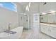 Bright main bathroom with a freestanding tub and a glass shower at 4062 Brookside Pkwy, Decatur, GA 30034