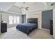 Spacious main bedroom with tray ceiling and wood accent wall at 4062 Brookside Pkwy, Decatur, GA 30034