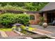 A peaceful backyard featuring a soothing fountain, pond, and well-manicured landscaping at 114 Lees Lake Rd, Fayetteville, GA 30214