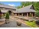 Spacious backyard featuring a lily pond, gravel paths, and professional landscaping at 114 Lees Lake Rd, Fayetteville, GA 30214