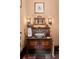 Charming powder room with a dark marble countertop and decorative light fixtures at 114 Lees Lake Rd, Fayetteville, GA 30214