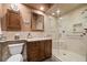 Bathroom with marble countertop vanity and glass-enclosed shower stall at 114 Lees Lake Rd, Fayetteville, GA 30214