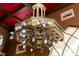 Ornate chandelier with custom wood design on a red painted ceiling at 114 Lees Lake Rd, Fayetteville, GA 30214
