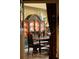 Formal dining room with a china cabinet, dining table and wood floors at 114 Lees Lake Rd, Fayetteville, GA 30214
