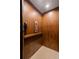 Interior view of an elevator featuring beautiful wood paneling and simple user controls at 114 Lees Lake Rd, Fayetteville, GA 30214
