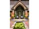 Grand entrance featuring arched doorway, a tranquil lily pond, and elegant landscaping at 114 Lees Lake Rd, Fayetteville, GA 30214