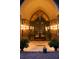 Welcoming portico entrance featuring arched doorway, brick pillars, and decorative outdoor lighting at 114 Lees Lake Rd, Fayetteville, GA 30214