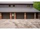 Exterior view of a detached garage showcasing multiple bays and stone accents at 114 Lees Lake Rd, Fayetteville, GA 30214