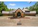 A charming exterior view showcasing a brick home and spacious driveway at 114 Lees Lake Rd, Fayetteville, GA 30214