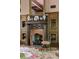 Elegant fireplace with a decorative mantel, mirrored accent, and flanking wooden display shelves that add charm at 114 Lees Lake Rd, Fayetteville, GA 30214