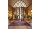 Elegant foyer with arched entry door and large Persian rug at 114 Lees Lake Rd, Fayetteville, GA 30214