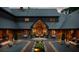 Custom home with water feature that leads to a charming outdoor seating area, beautiful gardens, and unique architectural design at 114 Lees Lake Rd, Fayetteville, GA 30214