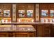 Close-up of kitchen showcasing custom wood cabinets with display lighting at 114 Lees Lake Rd, Fayetteville, GA 30214