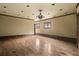 Spacious living room with hardwood floors, high ceilings, and gothic style windows at 114 Lees Lake Rd, Fayetteville, GA 30214