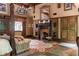 Cozy main bedroom featuring a fireplace, patterned rug, and unique storage cabinet at 114 Lees Lake Rd, Fayetteville, GA 30214
